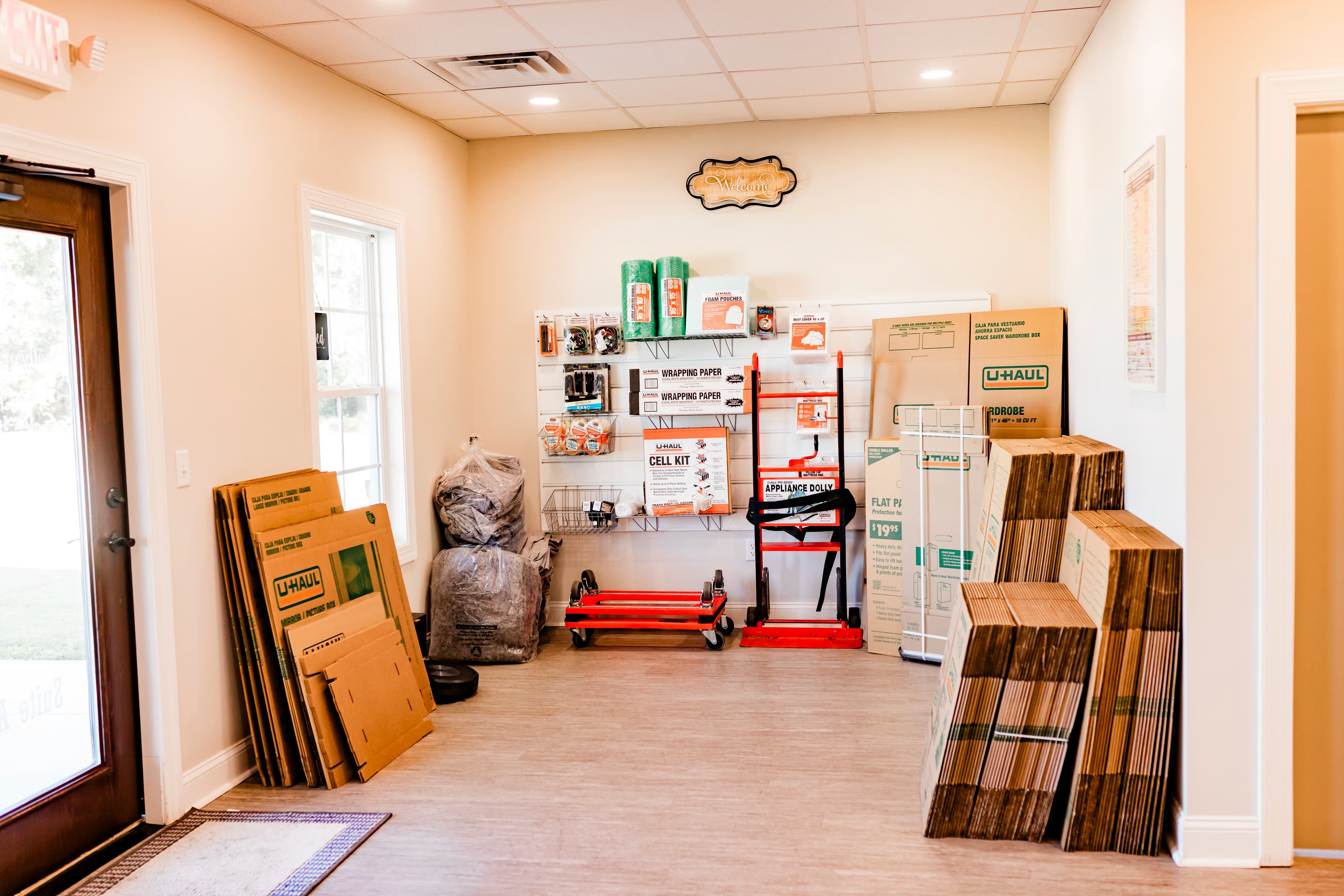 Moving supplies including boxes, packing materials, and dollies in the Southern Storage office